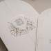 Oval Kesimli Çiçekli Monogram Detaylı Düğün Davetiyesi Oval Kesimli Çiçekli Monogram Detaylı Düğün Davetiyesi